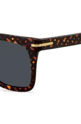 Gafas de sol con monograma estampado y componentes metálicos dorados