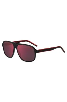 Gafas de sol de acetato negro con lentes de tono rojo