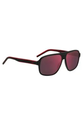 Gafas de sol de acetato negro con lentes de tono rojo