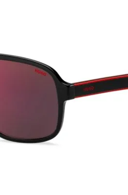 Gafas de sol de acetato negro con lentes de tono rojo