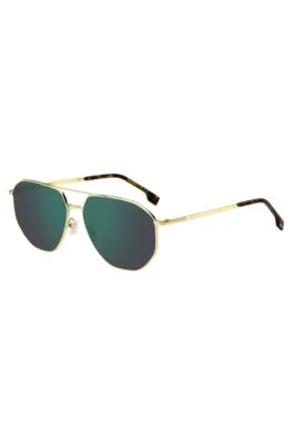 Gafas de sol en tono dorado con lentes verdes