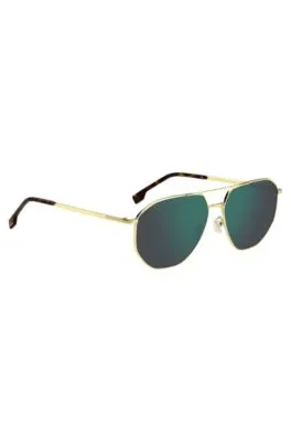 Gafas de sol en tono dorado con lentes verdes